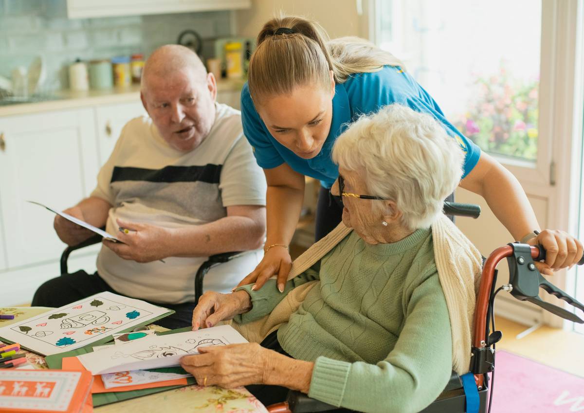 senior assisted living apartments with residents enjoying a garden courtyard